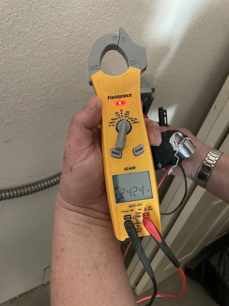 Voltage testing with clamp meter during Electrical Installation Services in Mascotte